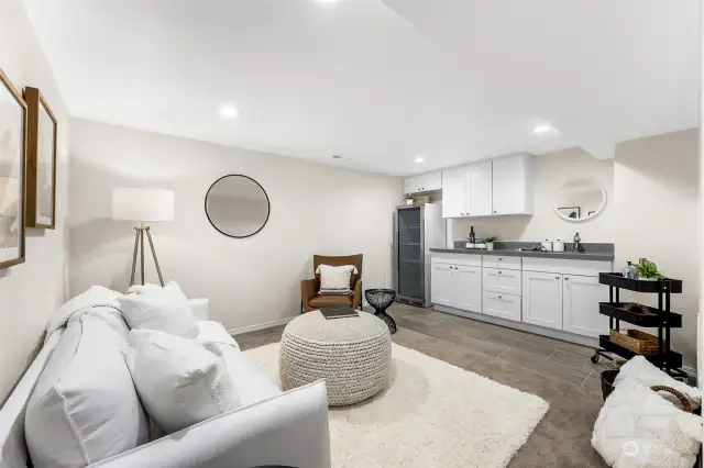 When you step downstairs, immediately drawn to the bonus kitchenette and bonus area, perfect for movies, office, games, etc. Tall fridge is new, and staying with the house