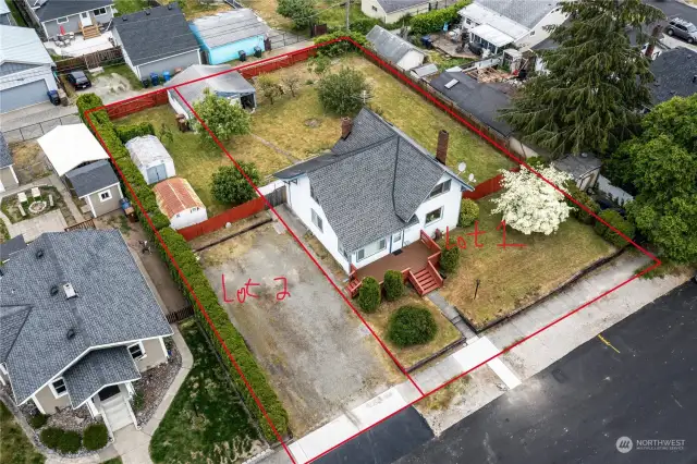 This Home is on a 9000 sq. ft. lot with a oversized 1 car garage off the alley, but does NOT include the parking area to the left of the home in front, which is a separate 25 ft. by 120 ft. lot for sale for $125,000.