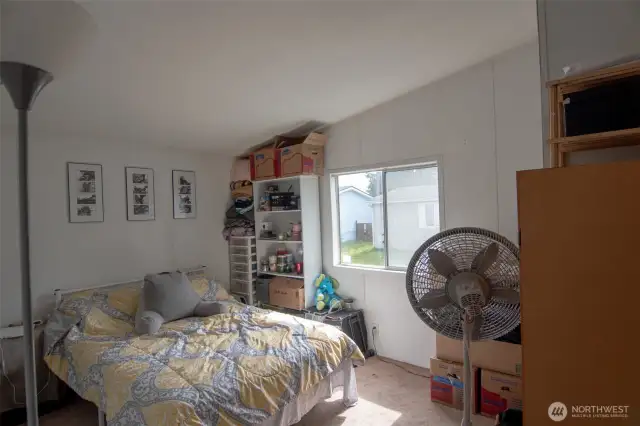 All bedrooms feature vaulted ceilings.