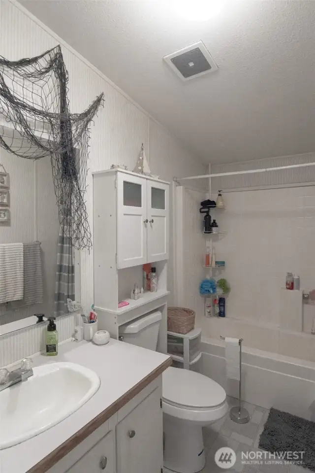 Full bath in hall off of spare bedrooms.