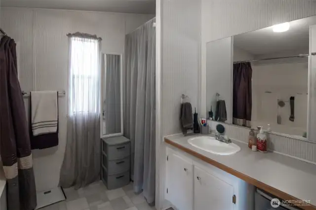 Primary bathroom with shower and soaking tub.