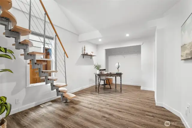 Primary bedroom with stairs to loft