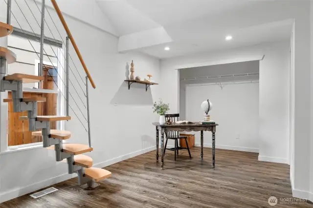Primary bedroom with stairs to loft