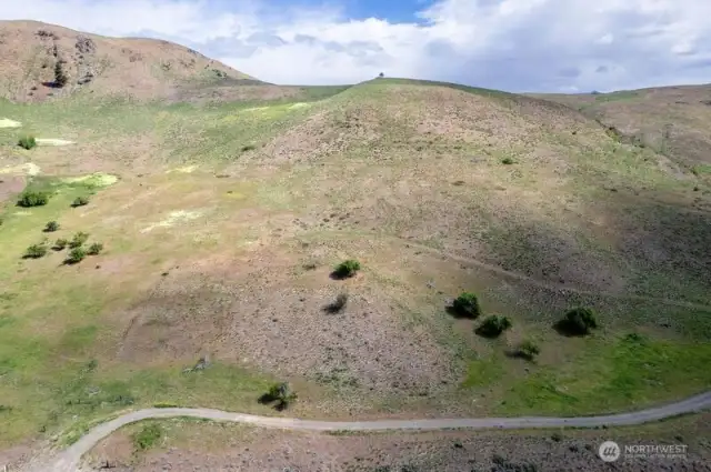 Acreage from high with hillside backdrop