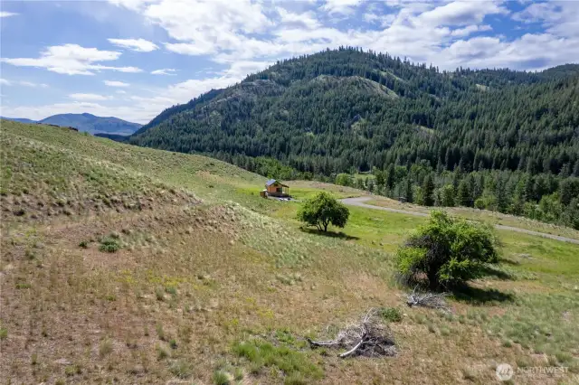 East SE View from acreage. Neighbors cabin in distance.