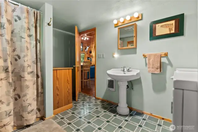 3/4 bathroom with laundry space.
