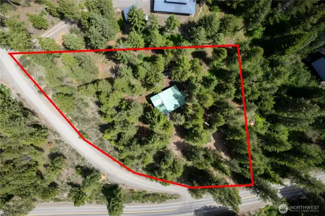 1.15 acres with room for expansion, additional outbuildings, or a garage. Note private access from Goat Creek Rd.  You do not have to drive into the development to access your home.