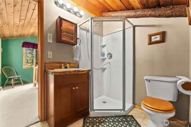 3/4 bathroom and closet area off of the primary bedroom upstairs.