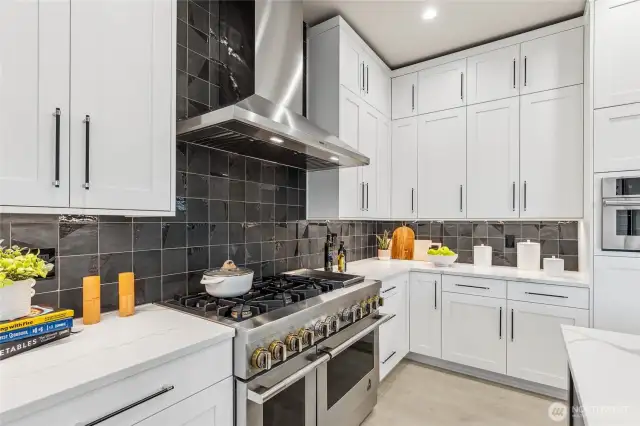 Enjoy hosting in your chef's kitchen equipped with JennAir appliances including 36” built-in refrigerator + 24” built in freezer, 48” dual fuel gas professional range with griddle, wall-mounted hood, built-in microwave oven with speed-cook.