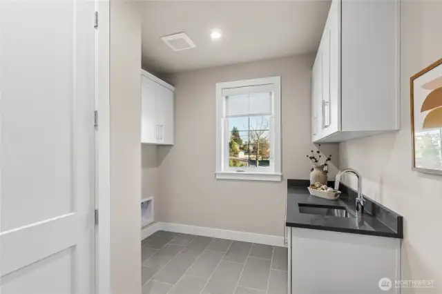 Upstairs Laundry, adequate storage!
