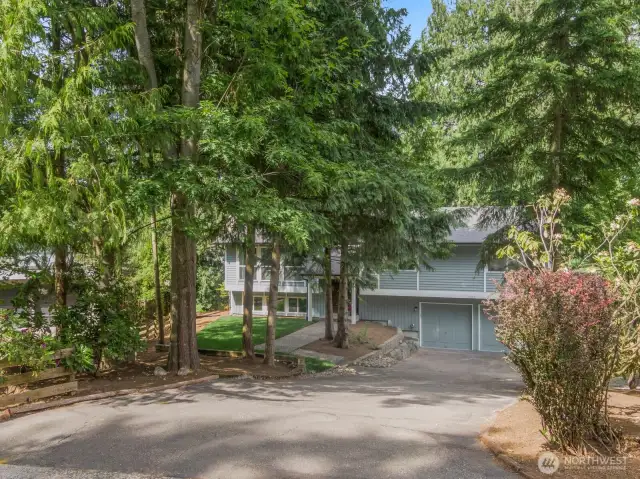 The long wide driveway has enough space to park 4-6 cars.
