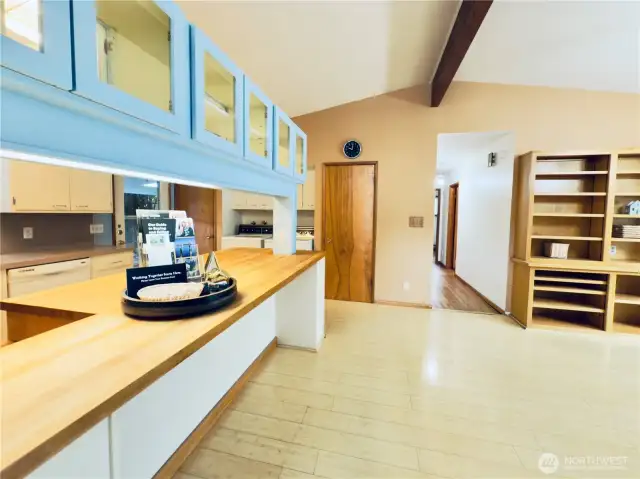 Vaulted ceilings in dining room and kitchen, open, kitchen peninsula , butcher-block counter, all appliances stay, built-in shelving