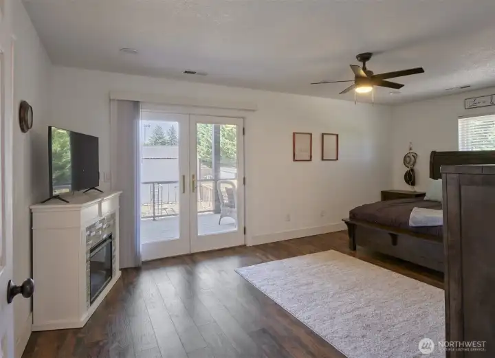 Primary bedroom with covered balcony