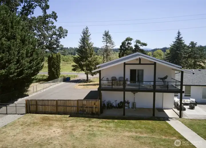 Covered balcony off primary suite -patio below