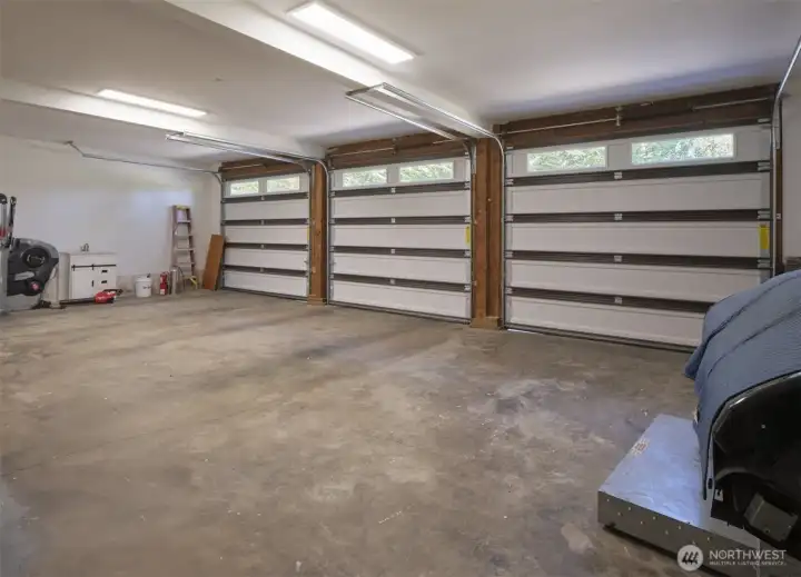 Interior of 3 car garage w/attached storage