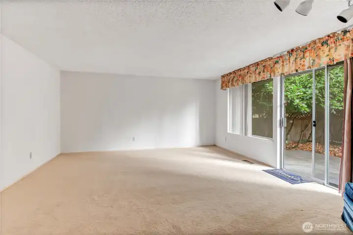 Living room with slider to backyard.