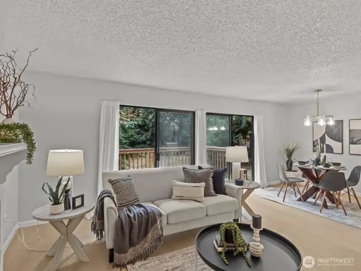 The large living room also has a sliding glass door, providing an abundance of natural light.