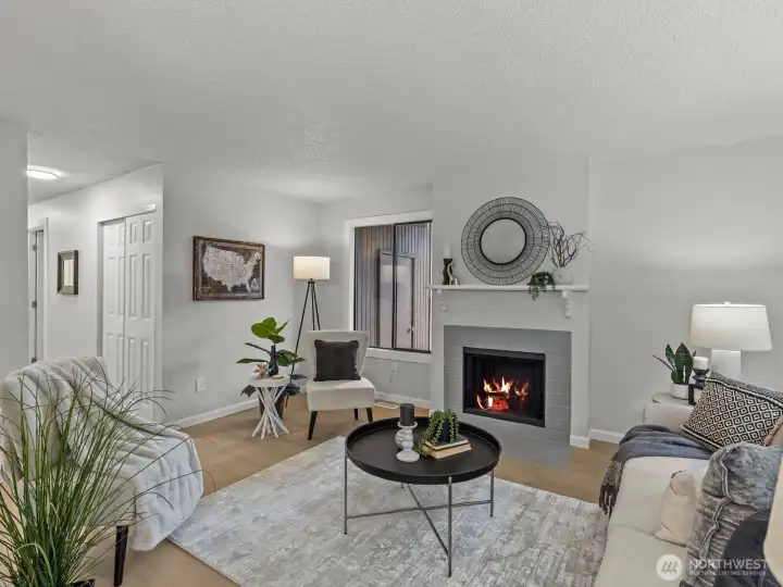 Cozy up to the wood burning fireplace on the chilly nights. You'll notice the storage closet outside, through the window.