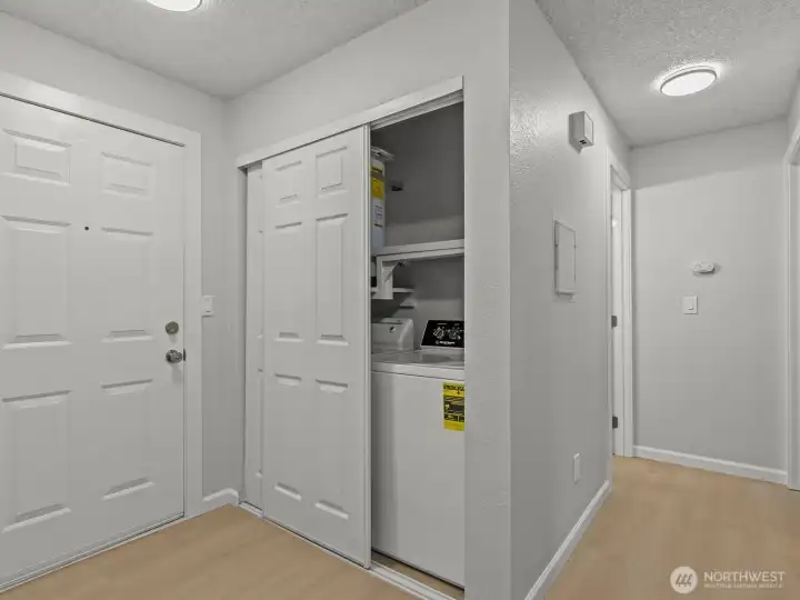 Just inside the front door is the in-unit laundry.
