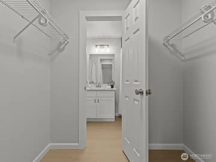 A walk-through closet provides private access to the bathroom.