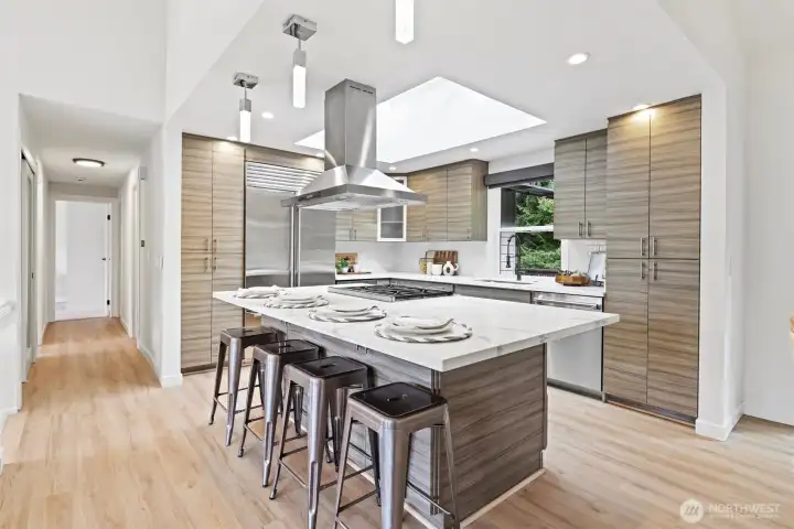 Oversized kitchen island with chef inspired kitchen and professional grade appliances Subzero, Wolf, Thermador. Heated floors in kitchen