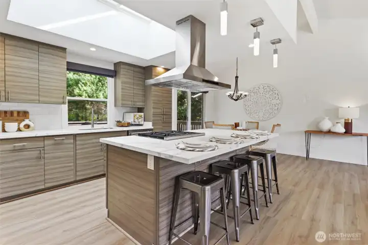 Oversized kitchen island with chef inspired kitchen and professional grade appliances Subzero, Wolf, Thermador. Heated floors in kitchen