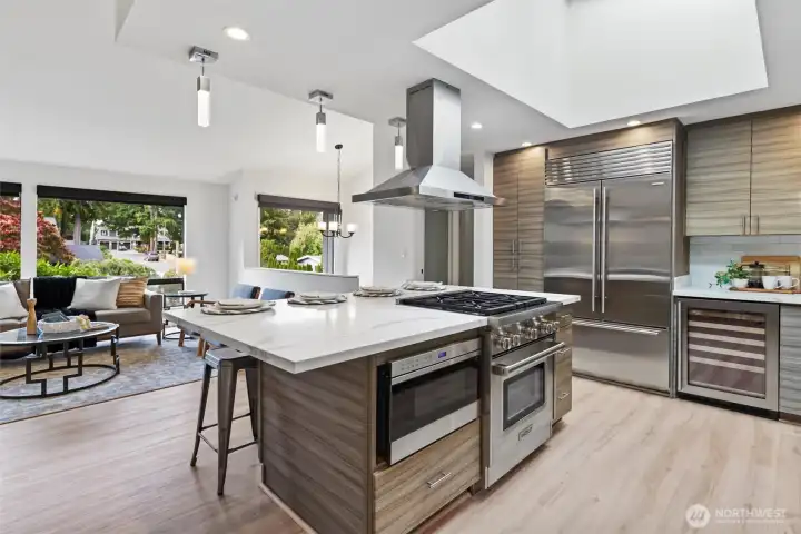 Oversized kitchen island with chef inspired kitchen and professional grade appliances Subzero, Wolf, Thermador. Heated floors in kitchen