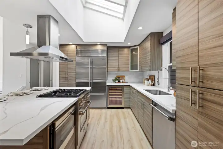 Oversized kitchen island with chef inspired kitchen and professional grade appliances Subzero, Wolf, Thermador. Heated floors in kitchen