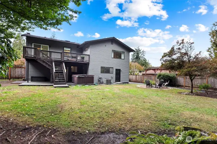 Back of home - entertaining deck, Sundance hot tub, large flat fully fenced lot