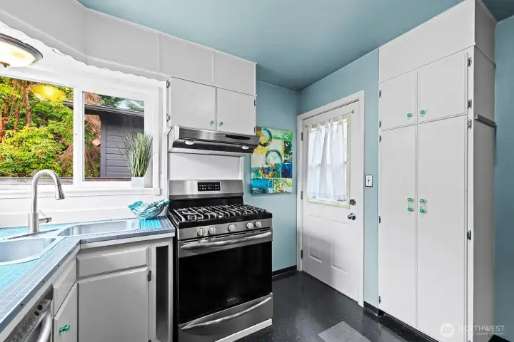 Traditional kitchen has been updated with new appliances and a wonderful corner window.