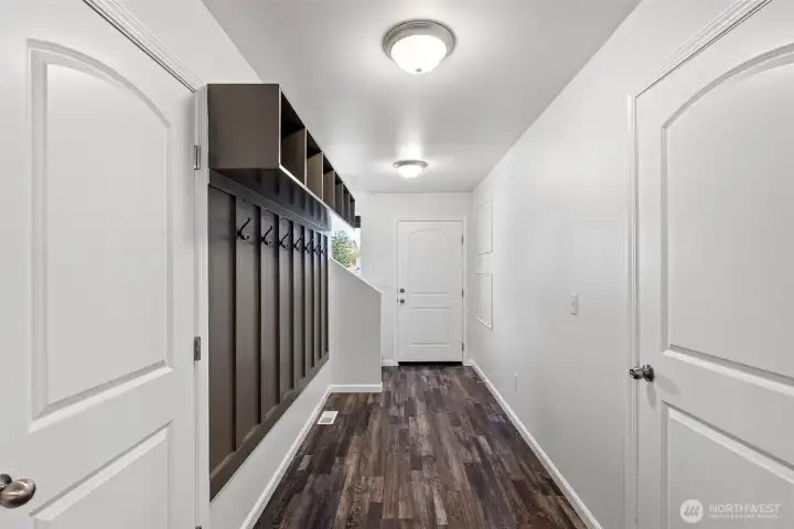 Entry way with built in storage cubbies and coat hooks