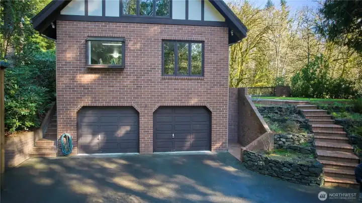 Side view of home looking at the two car garage. The right side of the garage is converted into storage space, but can easily be converted back.