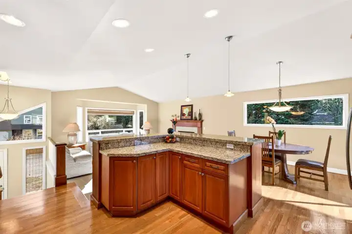 From the split level landing, you can see how well the home is organized for daily life, kitchen and dining at the center, with open sightlines into the living room.