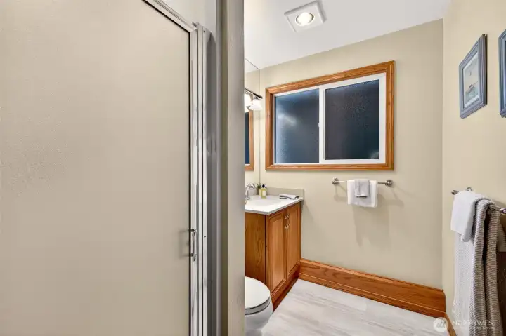 Adjacent to the 4th bedroom you will find a convenient 3/4 bath with a walk in shower, updated vanity, and a window for natural light and ventilation. Durable finishes and a straightforward layout make it an easy, low maintenance space that works well for guests and daily routines.
