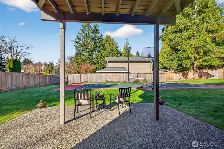 The patio creates a true outdoor living zone, protected from the elements and perfectly positioned to enjoy the backyard. Step out and you’re connected to a level lawn and the sports court, an ideal setup for entertaining, casual evenings outside, and easy everyday use of the yard.