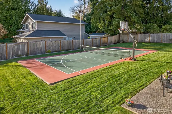The sports court is a true differentiator, designed for everyday fun and effortless hosting. With plenty of surrounding lawn kept brightly green with a full sprinkler system, and a fenced perimeter, it creates a private, dedicated space for active living right at home.