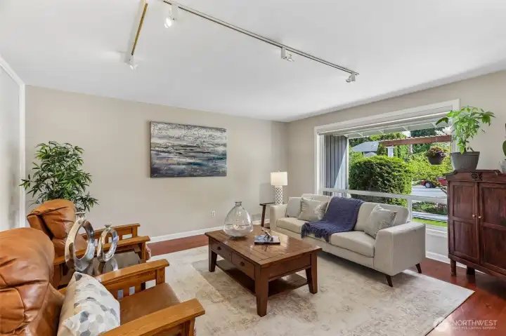 Sunny formal living area is roomy for relaxing evenings.