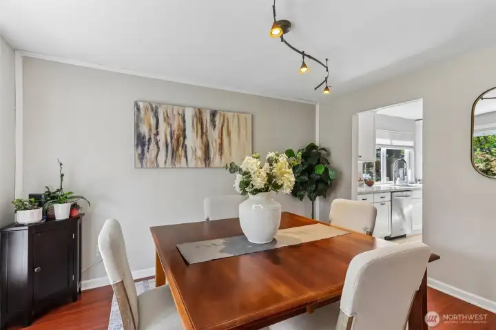 Casual dining room is adjacent to the updated kitchen.