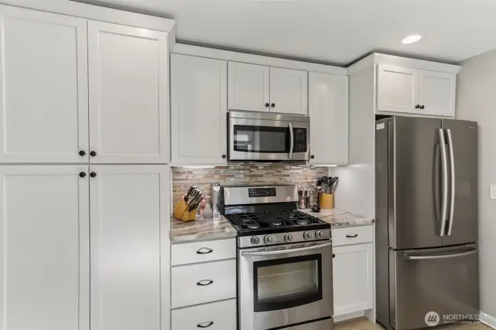 Quartzite counters with tile backsplash.
