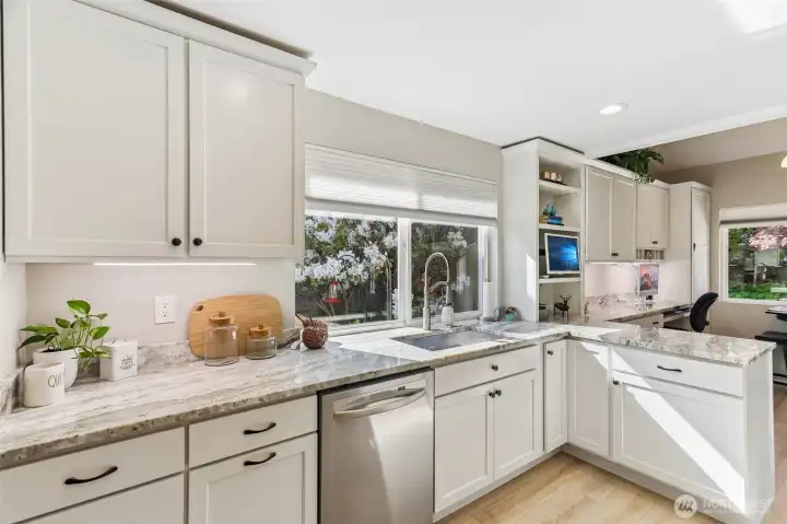 Sunfilled kitchen area and plenty of workspace for food prep.