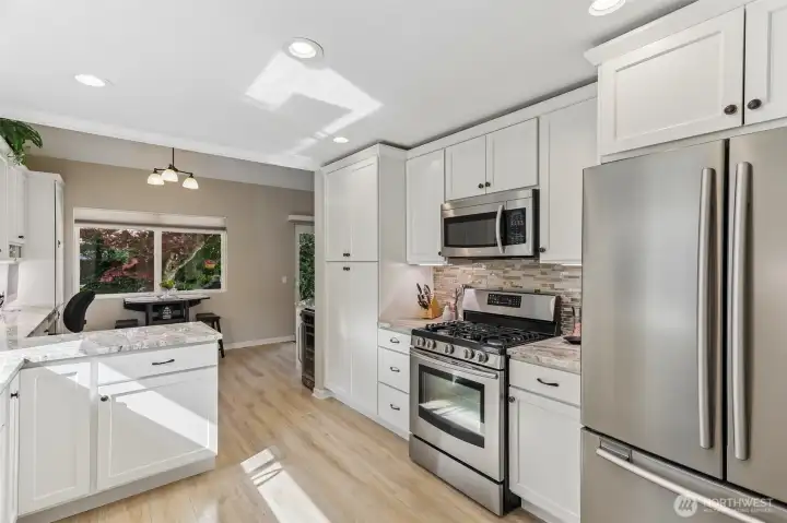 Stainless steel appliances. Gas range as well as a wine fridge.