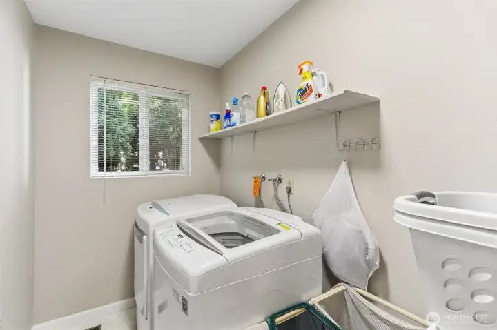 Convenient laundry room is adjacent to the primary bedroom.