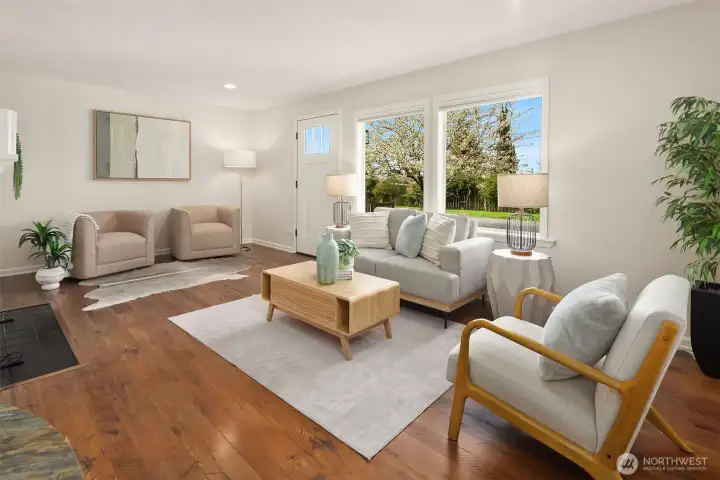 Spacious living room with large windows.