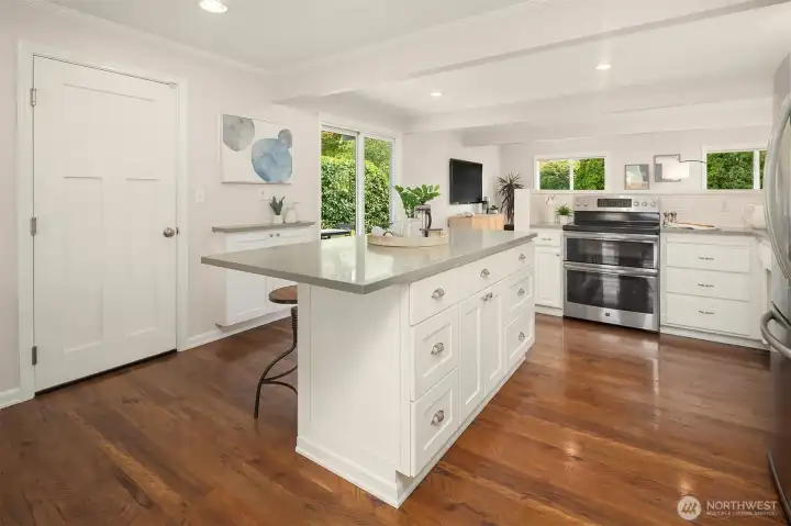 Spacious island with barstool seating and additional storage.