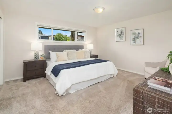Primary bedroom with room for siting area.