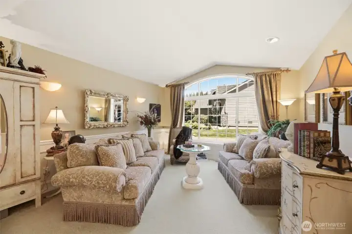 Formal Living Room with oversized windows to bring in natural light.