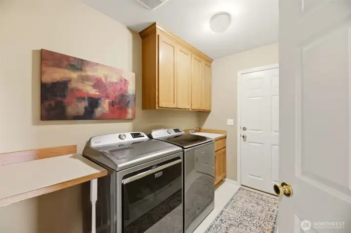 Utility room with extra storage - leads to 3 car garage