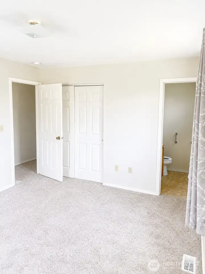 Primary bedroom & half bathroom