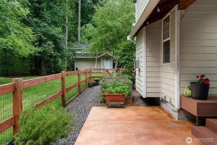 side yard with raised garden beds