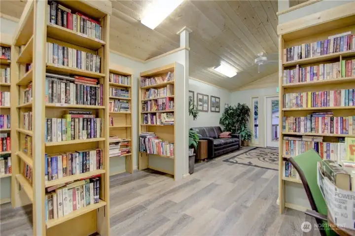Community library and book exchange with comfortable nooks to sit and read.